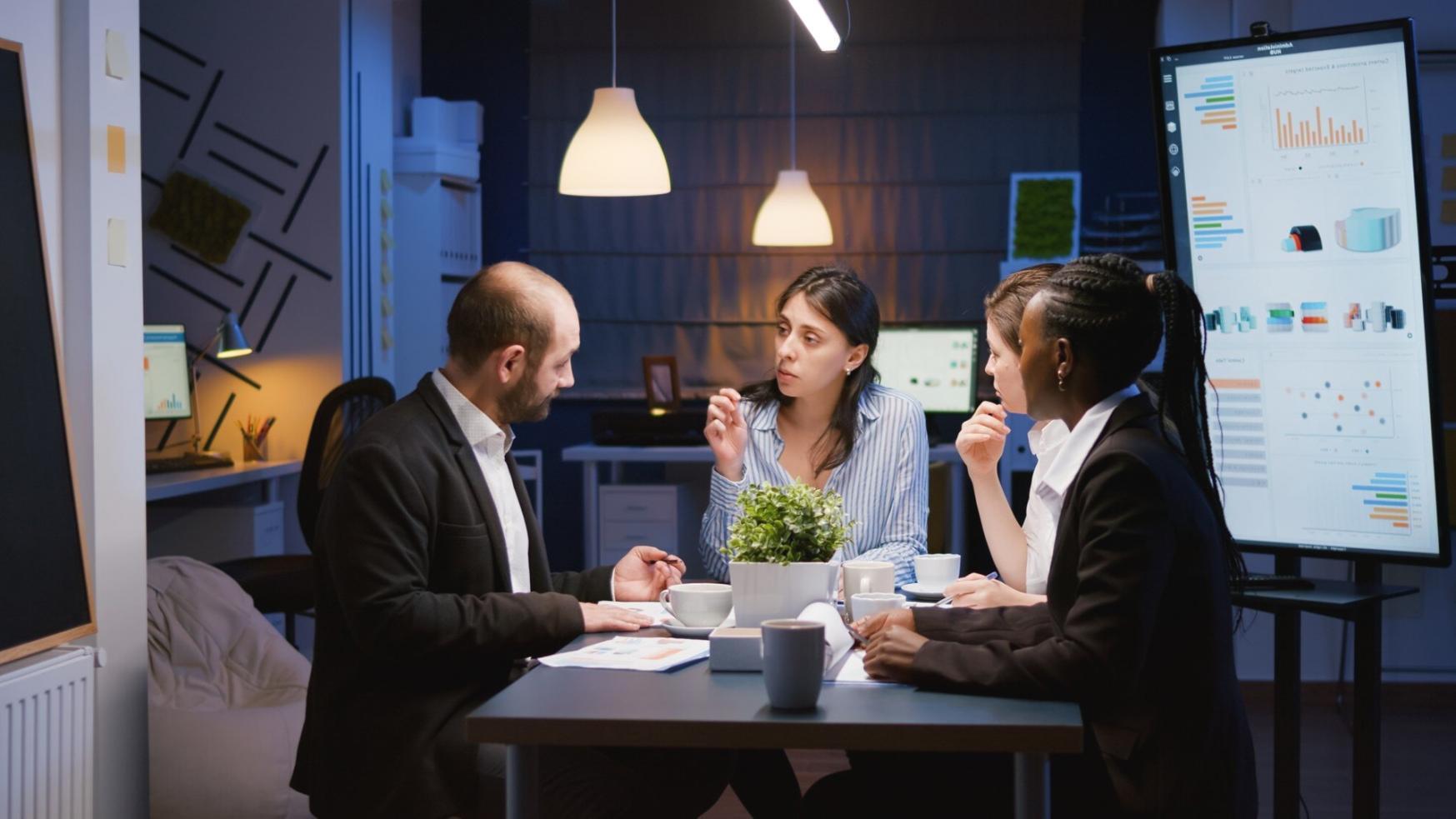 Team collaboration workspace showing diverse perspectives in financial education